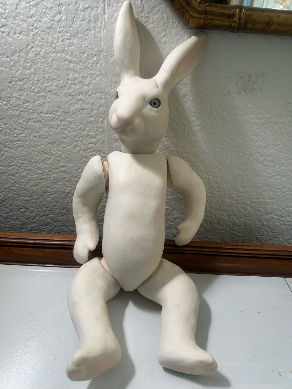 Ceramic bisque articulated rabbit doll with blue glass eyes